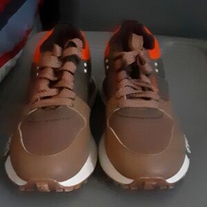 Brown, orange, and white sneakers